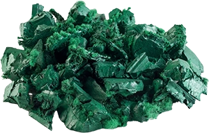 A cluster of dark green, jagged crystals with fibrous textures and sharp edges, arranged in a compact formation.