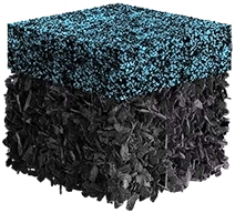 A cube with a top layer of small blue particles and a bottom layer of dark, crumpled material.